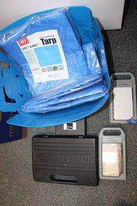 lot 830 image: Tools and Tarps (4) unopened 5x7 tarps and tool sets
