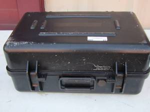 lot 22 image: Black vacuum seal cases with padding inside