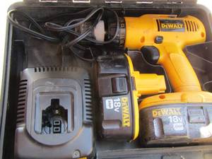 lot 18 image: DeWalt drill in case with charger and battery
