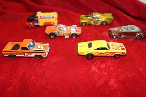 lot 150 image: Orange and Yellow Hot Wheels Cars