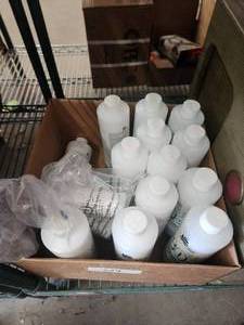 lot 124 image: Selection of cream peroxide developer 20 - 40v 16oz bottles and a few smaller bottles