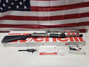 lot 56 image: New Benelli M4 11795 12ga Shotgun w Ghost Ring Sights & H2O titanium Cerakote