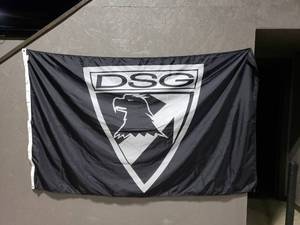 lot 890 image: DSG Oversize Badge Logo Flag.  Measures 8 x 5