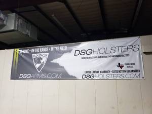 lot 900 image: Long DSG Holsters All Weather Banner.  Measures 16 x 4