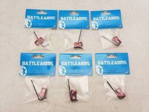 lot 1009 image: Battle Arms Enhanced Modular Magazine Release Large   Anodized Red - QUANTITY 6 - BID IS TIMES THE QUANTITY