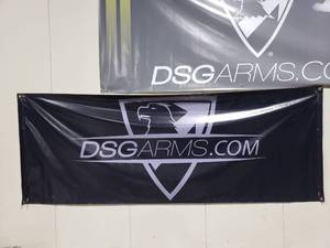 lot 1221 image: Black All Weather DSG Badge Logo Banner w Eyelets.  Measures 8 x 3