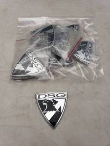 lot 1141 image: Lot of 10 DSG Badge Car Identification Emblems - Black  Silver