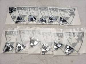 lot 1137 image: Lot of 12 DSG Badge Silver Decal & Car Badge Identification Emblems - Black  Silver