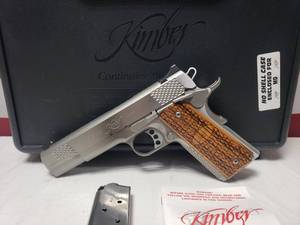 lot 1002 image: BEAUTIFUL Kimber Custom Stainless Raptor II .45 ACP Pistol w Wood Grips, Magazine & Case