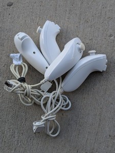 lot 229 image: Lot of 4 - Nintendo Wii Nun-Chuck