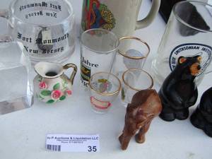 lot 35 image: shot glasses, bear and elephant dcor, beer mugs and more