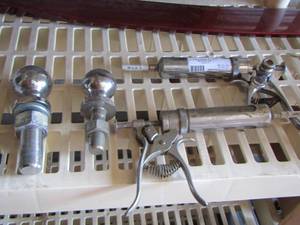 lot 82 image: cow injector needles, 2 trailer hitch balls