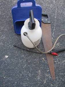 lot 131 image: hand saw, pump sprayer, and 