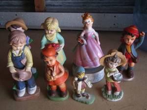 lot 17 image: ceramic  figurines little girls and boys