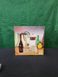 lot 10 image: Enol Matic bottle filler by Tenco