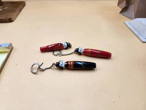 lot 138 image: Selection of 3 oriental themed keychain - pen (1 missing keychain)