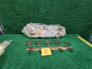 lot 125 image: Selection of metal Palm Tree wall hook decor.