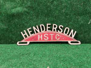 lot 195 image: Vintage Henderson license plate topper