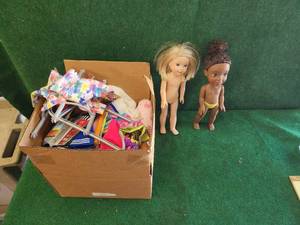 lot 312 image: Collection of doll clothes and accessories with 2 dolls American Girl and Disney