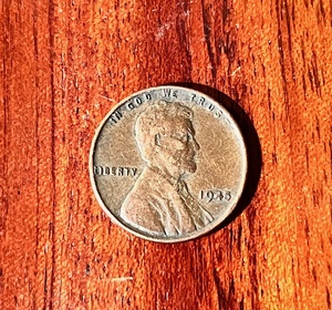 lot 136 image: 1945 No Mint Mark Wheat Penny WRim Rolled L Error