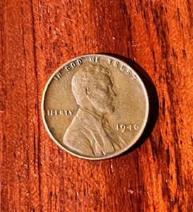 lot 137 image: 1946 No Mint Mark Wheat Penny W Rim Rolled L Error