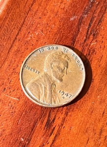 lot 138 image: 1947 D Wheat Penny WRim Rolled L Error