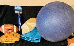 lot 178 image: Three (3) Exercise Balls, One Official NFL Wilson Football, Rawlings Softball Glove, &amp Spaulding Championship Pump
