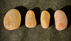 lot 210 image: Four (4) Polished Sunstone Palm Stones