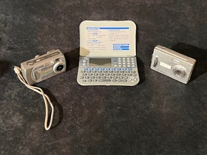 lot 265 image: Royal Electronic Pocket Organizer Business Personal Calculator ds3360 384kb PDA, Samsung Camera Digimax 301 3.2 Megapixel 3X Zoom, &amp Digital Camera 5 Megapixal Portable Camera W 2 Screen &amp 4x Digital Zoom