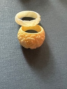 lot 541 image: Polished bone ring carved roses and Onyx ring