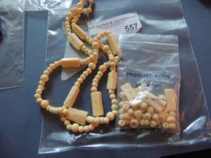 lot 557 image: Necklace  cream colored beads and  spare beads included