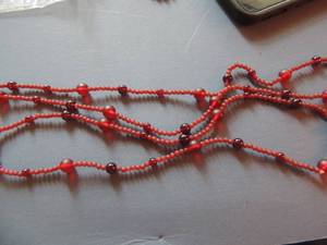 lot 553 image: Necklace 48 inch red beads