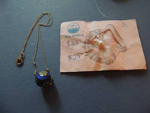 lot 550 image: Cloisonn ball on gold chain and individual pearl ( from SeaWorld pearl shop)