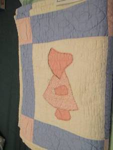 lot 321 image: child with bonnet homemade quilt