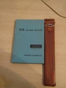 lot 357 image: slide rules book and a slide ruler in case