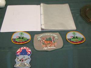 lot 133 image: qty 4 shirt patches, binder with sheet protectors