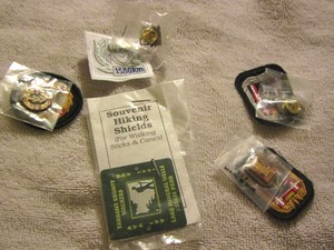lot 50 image: Souviners hiking shields, patches with matching hat pins