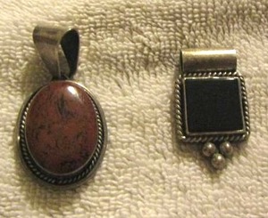 lot 79 image: STERLING  -black stone pendant with 925 on back, brown necklace pendant with 925 on the back