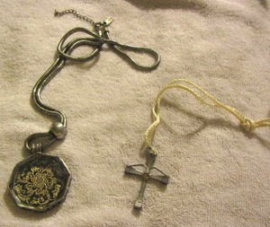 lot 90 image: Cross pendant on a CORD necklace, Marie Osmond reversible necklace
