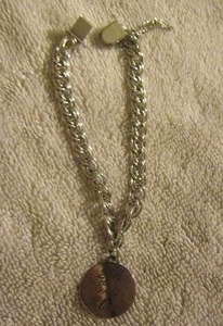 lot 113 image: BRACELET WITH GOLD ENGRAVED CHARM -1974 2nd ENG. Class