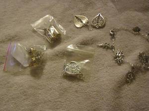 lot 127 image: Angel wing earrings, charm bracelet, gold flake earrings
