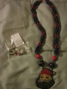 lot 139 image: Christmas earrings,   Santa wooden necklace