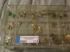 lot 173 image: jewelry container full of various clip on earrings