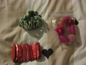 lot 191 image: red bracelet, green bracelet &  a bag of decorative beads