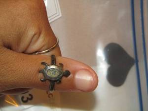 lot 203 image: Turtle ring - grey stone ring- pink stone ring - and a plain green ring