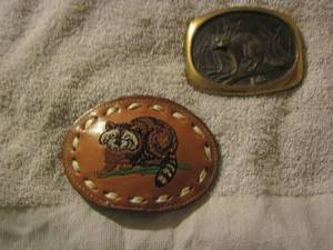 lot 247 image: 2 raccon belt buckle 1 leather 1 metal