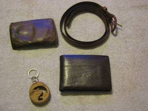 lot 257 image: small belt, wooden moon key chain and a wallet
