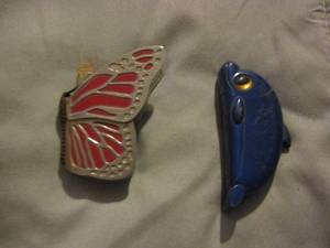 lot 378 image: Zippo butterfly lighter,  Dolphin  ZIPPO
