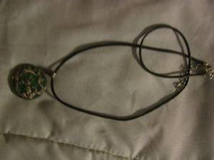 lot 413 image: Dragon necklace pendant on a leather rope
