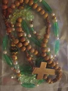 lot 525 image: wooden cross necklace, green necklace